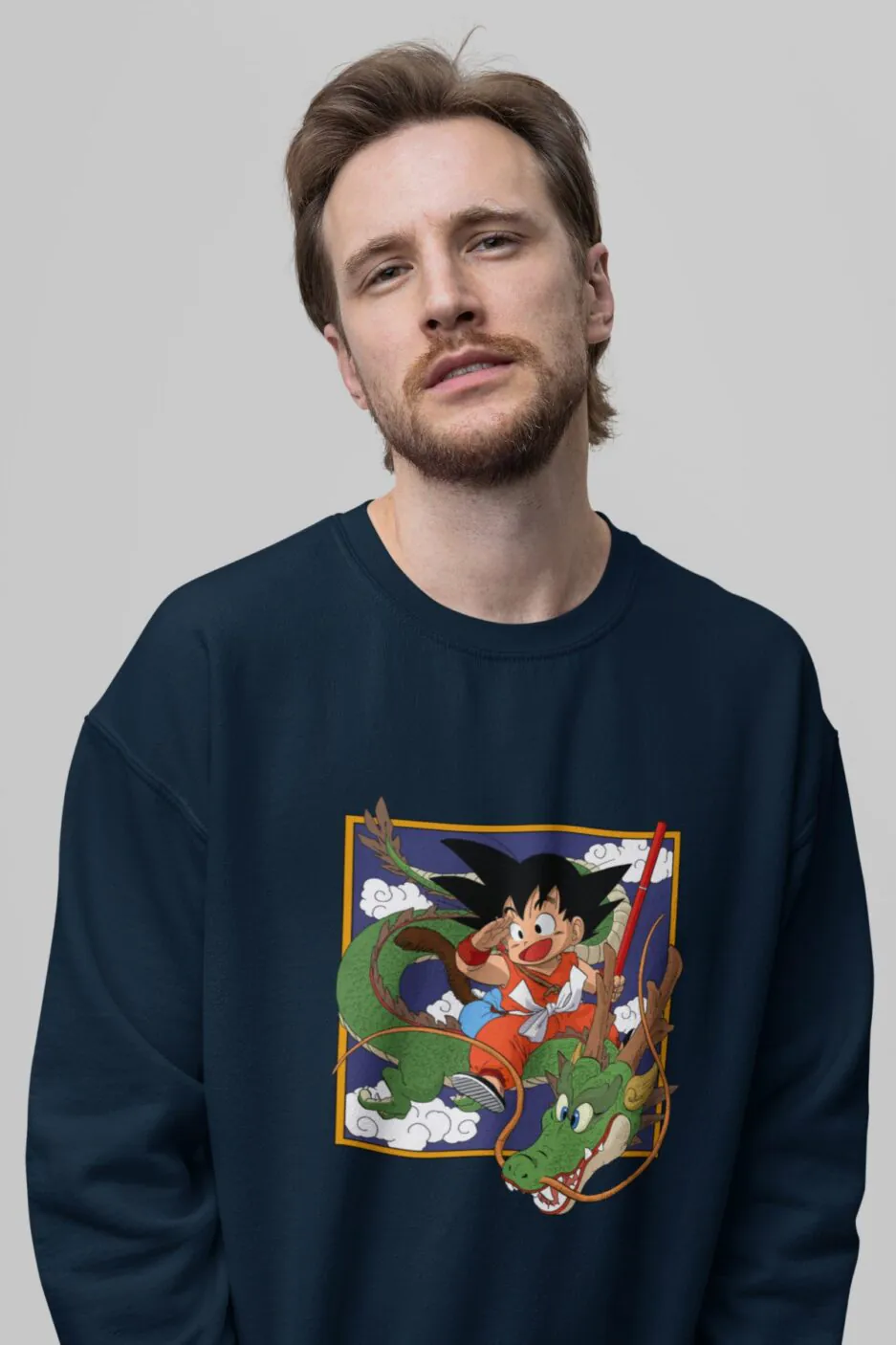 Close-up of Goku and Shenron artwork on a navy blue unisex sweatshirt.
