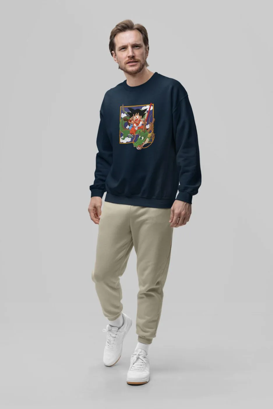 Man wearing a navy blue sweatshirt with Goku and Shenron Dragon Ball Daima design.
